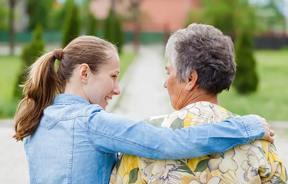 a young woman comforting an older woman